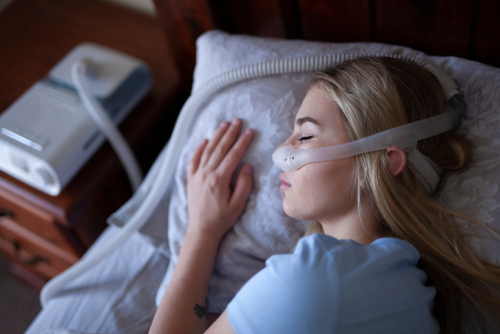 woman sleeping with cpap